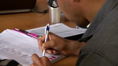 A boy doing exams