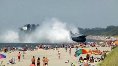 A hovercraft lands on a beach in Russia