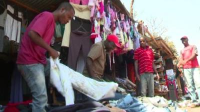 People at a second hand clothes market