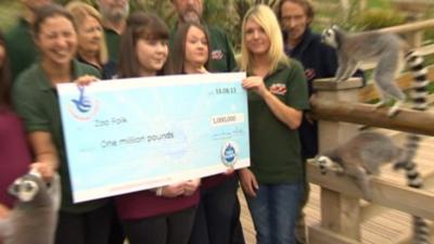 Zoo staff with the million pound cheque