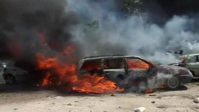 Car on fire in Tripoli following explosions