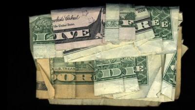 "Live free or die" written using folded dollar bills