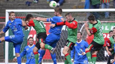 Match action from Glentoran against Ballinamallard