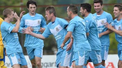 Ballymena United players celebrate victory over Dungannon Swifts