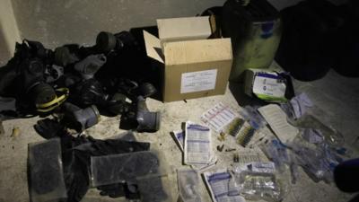 Chemical materials and gas masks purportedly found by Syrian government forces in the Damascus suburb of Jobar (24 August 2013)