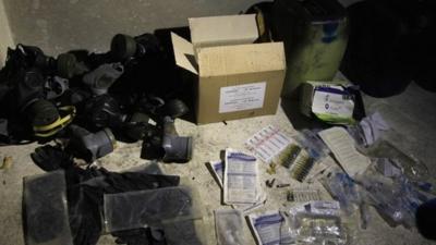 Chemical materials and gas masks purportedly found by Syrian government forces in the Damascus suburb of Jobar (24 August 2013)