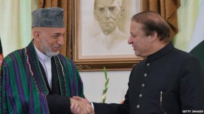 President Hamid Karzai shakes hands with Prime Minister Nawaz Sharif