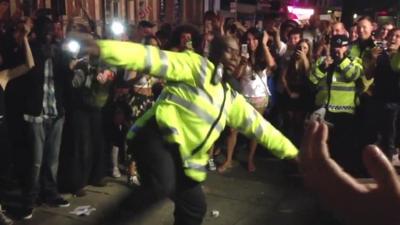 Police officer dancing at the Notting Hill Carnival