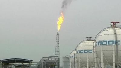 Flare burns at CNOOC oil refinery