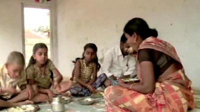 Family having a meal in India