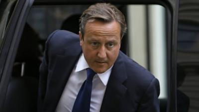 David Cameron arrives back in Downing Street