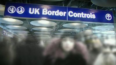 A blue sign reading 'UK Border Controls'