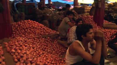 Piles of onions in market