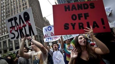 People protest against proposed US military action against Syria in Times Square, New York