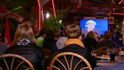 Voters watching the debate in a bar