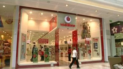 A Vodafone shop front in a shopping mall