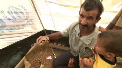 Mahmood Mahamid with his son and pet tortoise