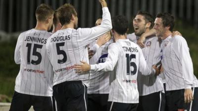 Coleraine players celebrate their 3-1 victory over Cliftonville