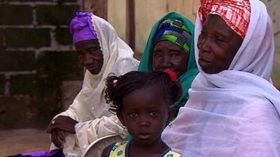 Gambian female circumcisers and child