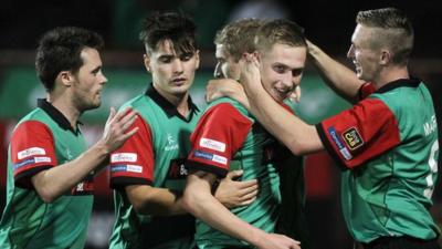 Glentoran players celebrate victory over Ards at The Oval