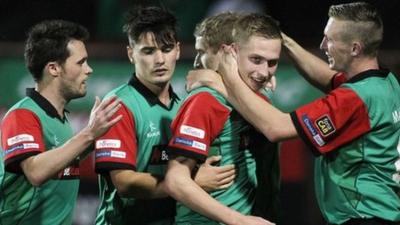 Glentoran players celebrate victory over Ards at The Oval