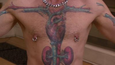 Man with organs tattoed on chest