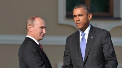 Russian President Vladimir Putin and US president Barack Obama shake hands