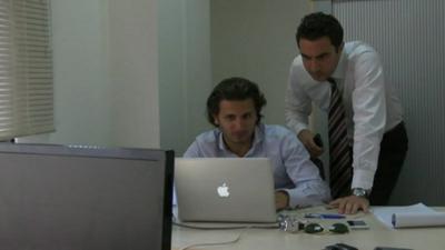 Two workers in an office.