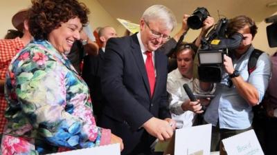 Australian Prime Minister Kevin Rudd casts his vote with his wife Therese Rein at a polling station in Brisbane