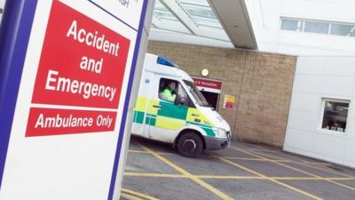 An ambulance near and Accident and Emergency sign