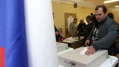 A man casting his vote in Moscow