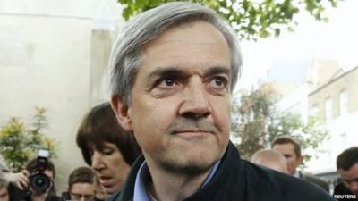 Former British cabinet minister Chris Huhne arrives back at his home after being released from prison