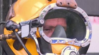 Julio Cesar Cu wearing his diving helmet