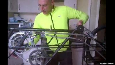 Graeme Obree showing how the cycle mechanism works on his bike Beastie