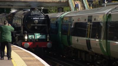 Steam locomotive leaving London Victoria station for the Bluebell Railway