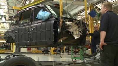 Black cab being constructed