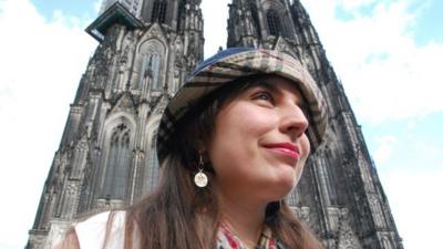 Helena Barcos beside Cologne's cathedral