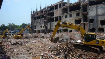 May 13, 2013, Bangladeshi Army personnel use heavy equipment as they continue to clear debris after an eight-storey building collapsed in Savar, on the outskirts of Dhaka.