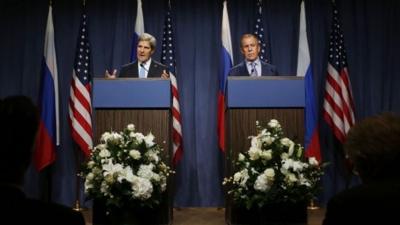 US Secretary of State John Kerry speaks next to Russian Foreign Minister Sergey Lavrov, (right)