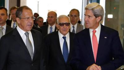 U.S. Secretary of State John Kerry, right, Russian Foreign Minister Sergey Lavrov, left, walk with the U.N.-Arab League envoy for Syria, Lakhdar Brahimi