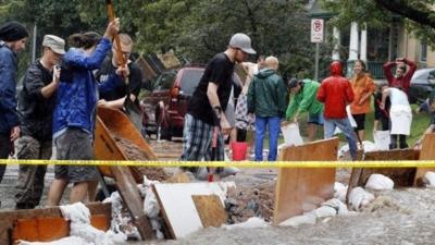 Residents try to divert floodwater from their homes in Boulder, Colorado