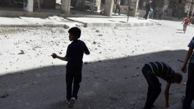 Children run after hearing what activists said was shelling