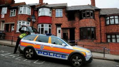 Police car outside fire house