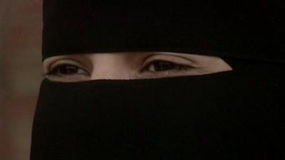 A woman's eyes through a niqab (face-veil)