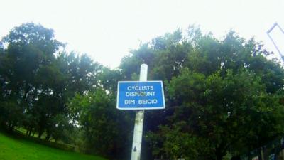 Cyclists' dismount sign