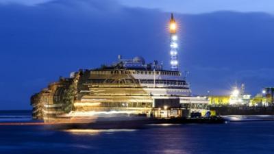 The wreck of Italy's Costa Concordia cruise ship emerges from water