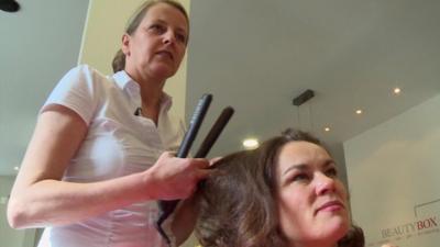 Monica on the left is a hairdresser. She tells the BBC she'd like German politicians to introduce a minimum wage.