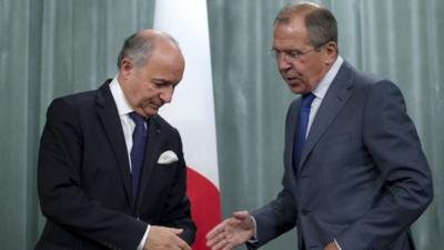 French Foreign Minister Laurent Fabius, left, and his Russian counterpart Sergei Lavrov