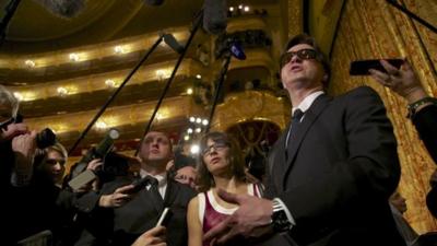 Artistic director of the Bolshoi ballet Sergei Filin, right, speaks to the media after a traditional annual meeting of the Bolshoi Theater in Moscow, Russia