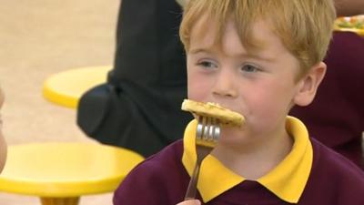 Schoolboy eating